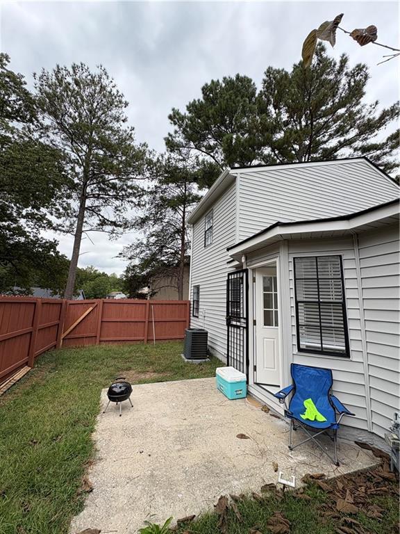 701 Pine Tree Trail, Unit 10E Atlanta, GA 30349 - Photo 33 of 33 a view of a house with a yard and sitting area