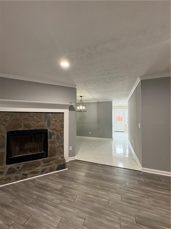 701 Pine Tree Trail, Unit 10E Atlanta, GA 30349 - Photo 6 of 33 a view of an empty room with wooden floor fireplace and a window