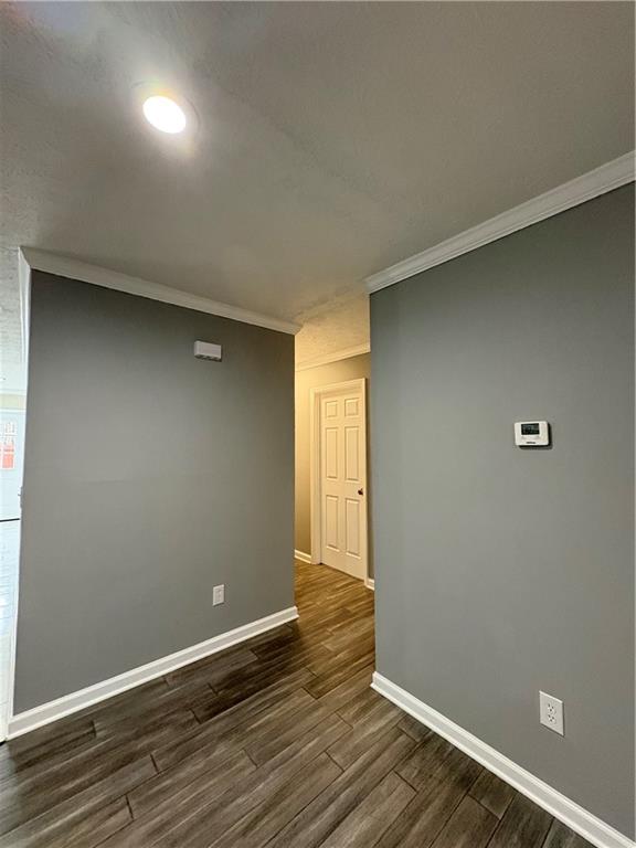 701 Pine Tree Trail, Unit 10E Atlanta, GA 30349 - Photo 7 of 33 an empty room with wooden floor and windows