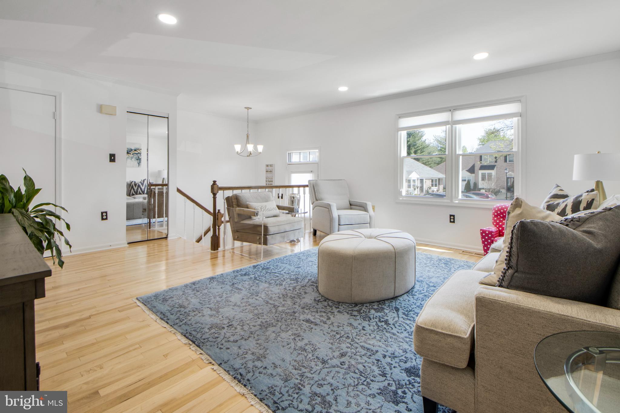 14432 Bakersfield Court Silver Spring, MD 20906 - Photo 1 of 60 a living room with furniture and a large window