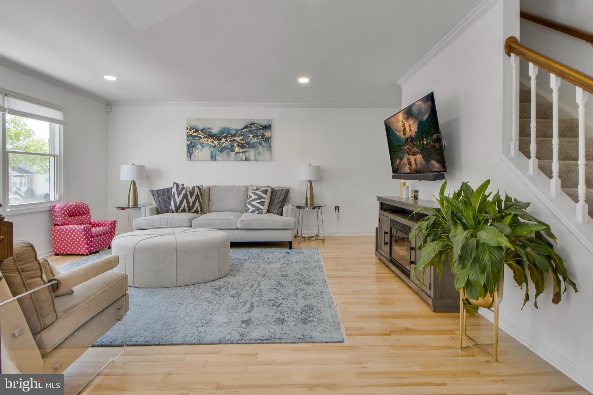 14432 Bakersfield Court Silver Spring, MD 20906 - Photo 10 of 60 a living room with furniture and a potted plant