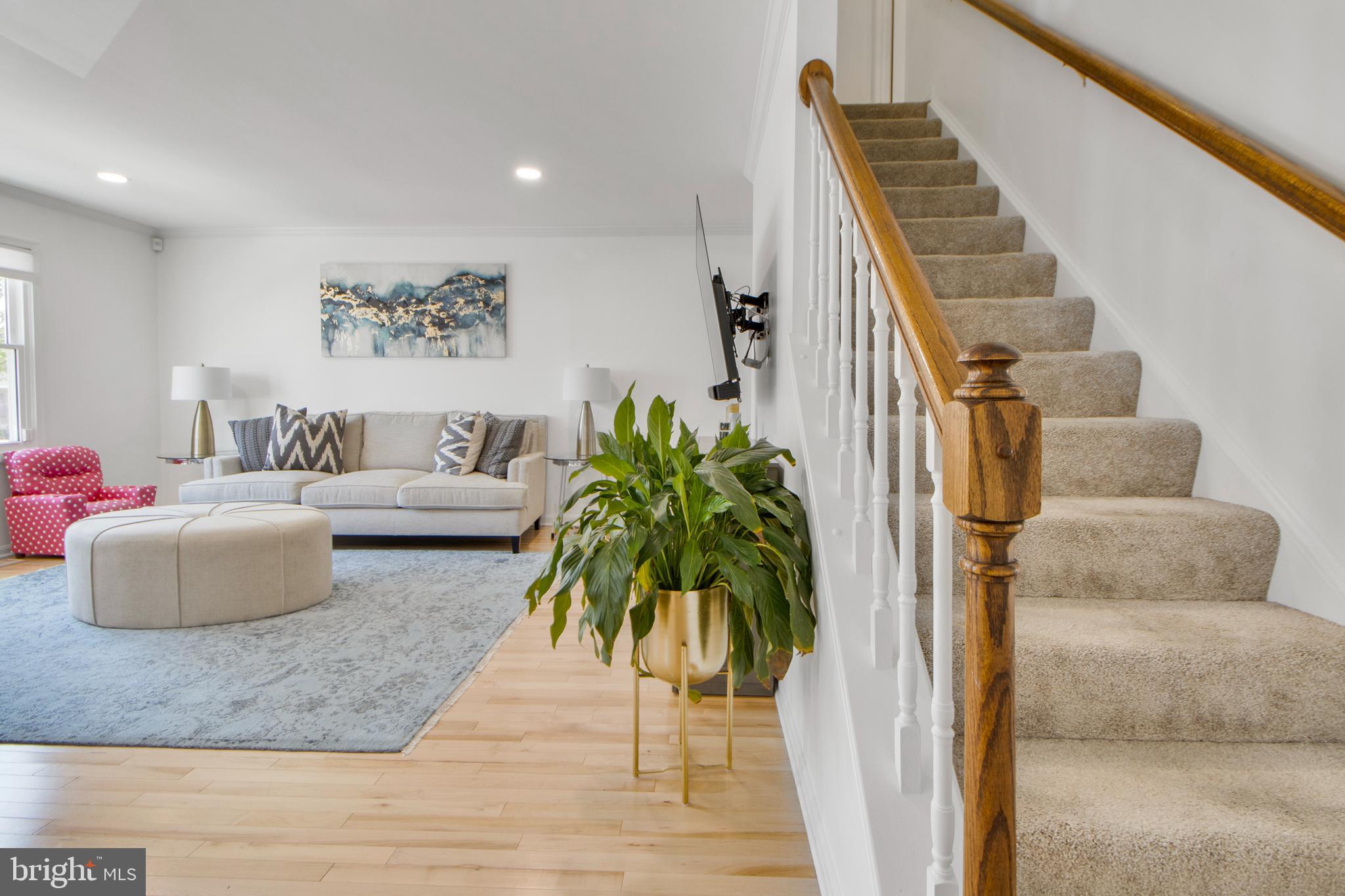 14432 Bakersfield Court Silver Spring, MD 20906 - Photo 13 of 60 a living room with furniture and wooden floor
