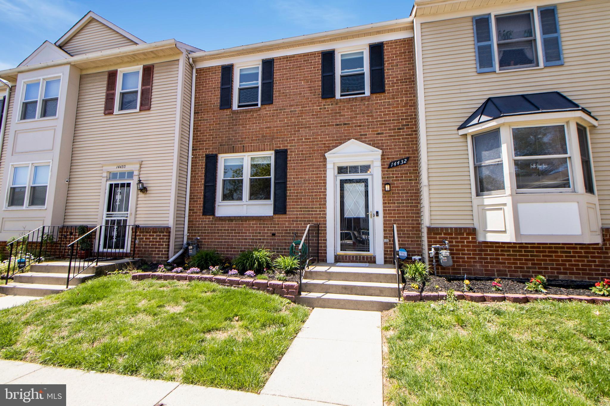 14432 Bakersfield Court Silver Spring, MD 20906 - Photo 2 of 60 a front view of a house with yard