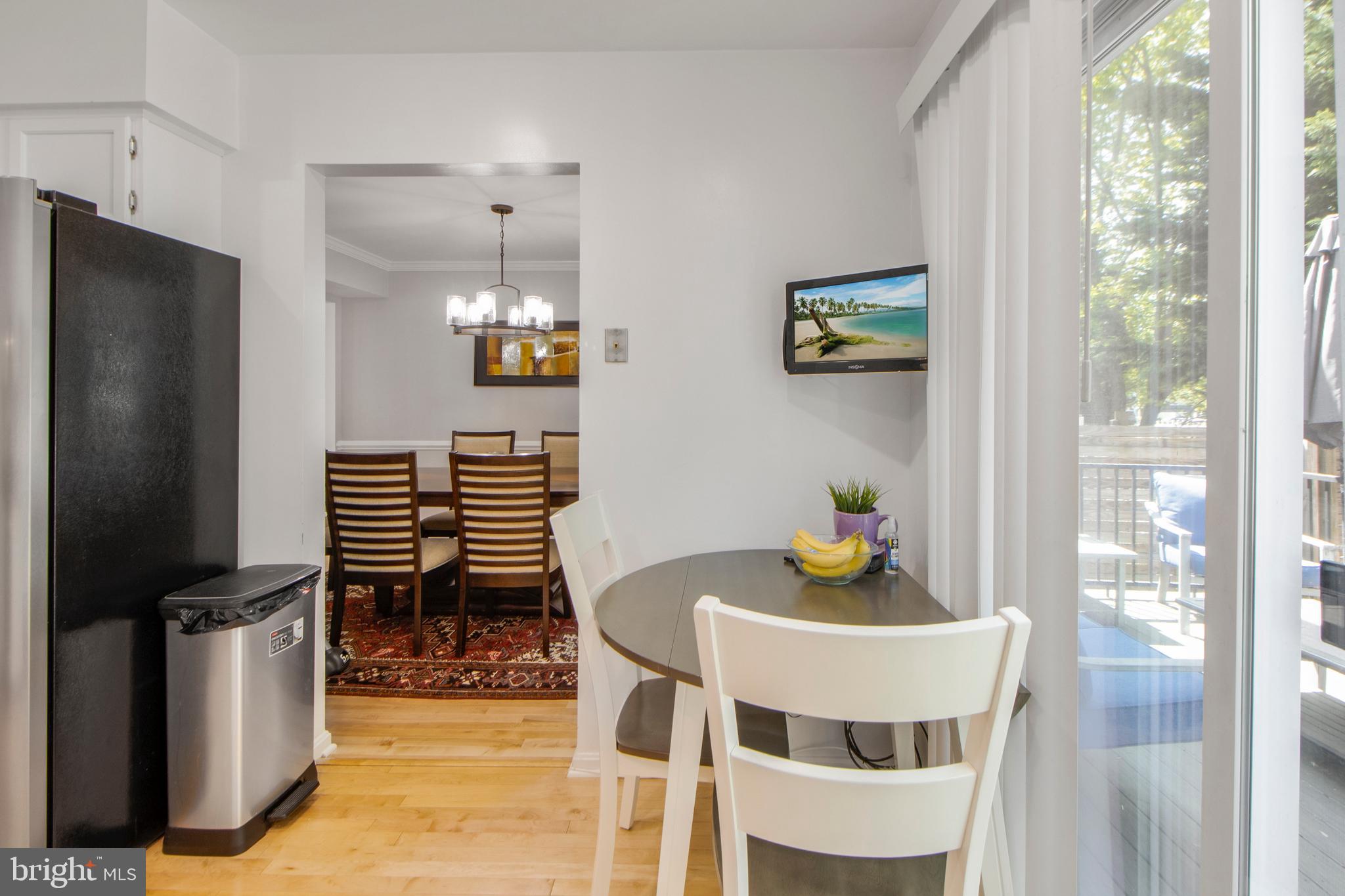 14432 Bakersfield Court Silver Spring, MD 20906 - Photo 23 of 60 a dining room with furniture and window