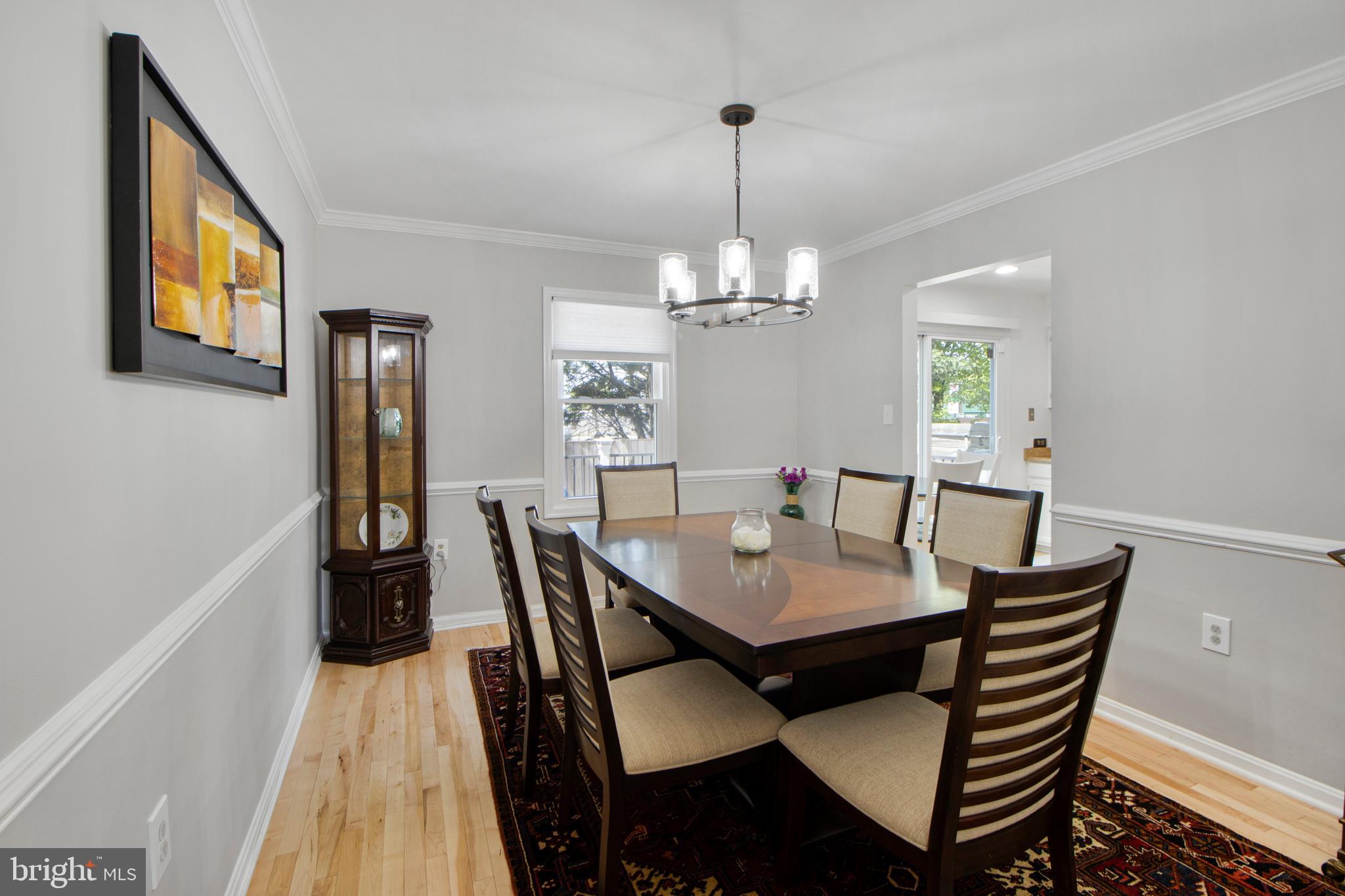 14432 Bakersfield Court Silver Spring, MD 20906 - Photo 27 of 60 a view of a dining room with furniture and wooden floor