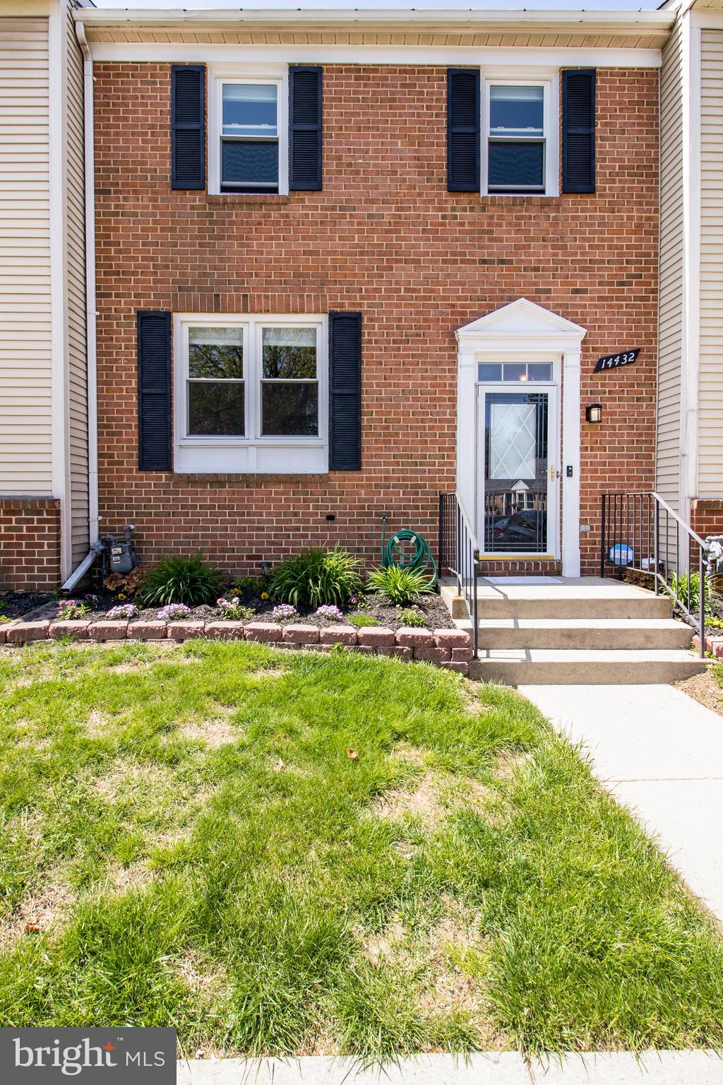 14432 Bakersfield Court Silver Spring, MD 20906 - Photo 3 of 60 a front view of a house with a yard