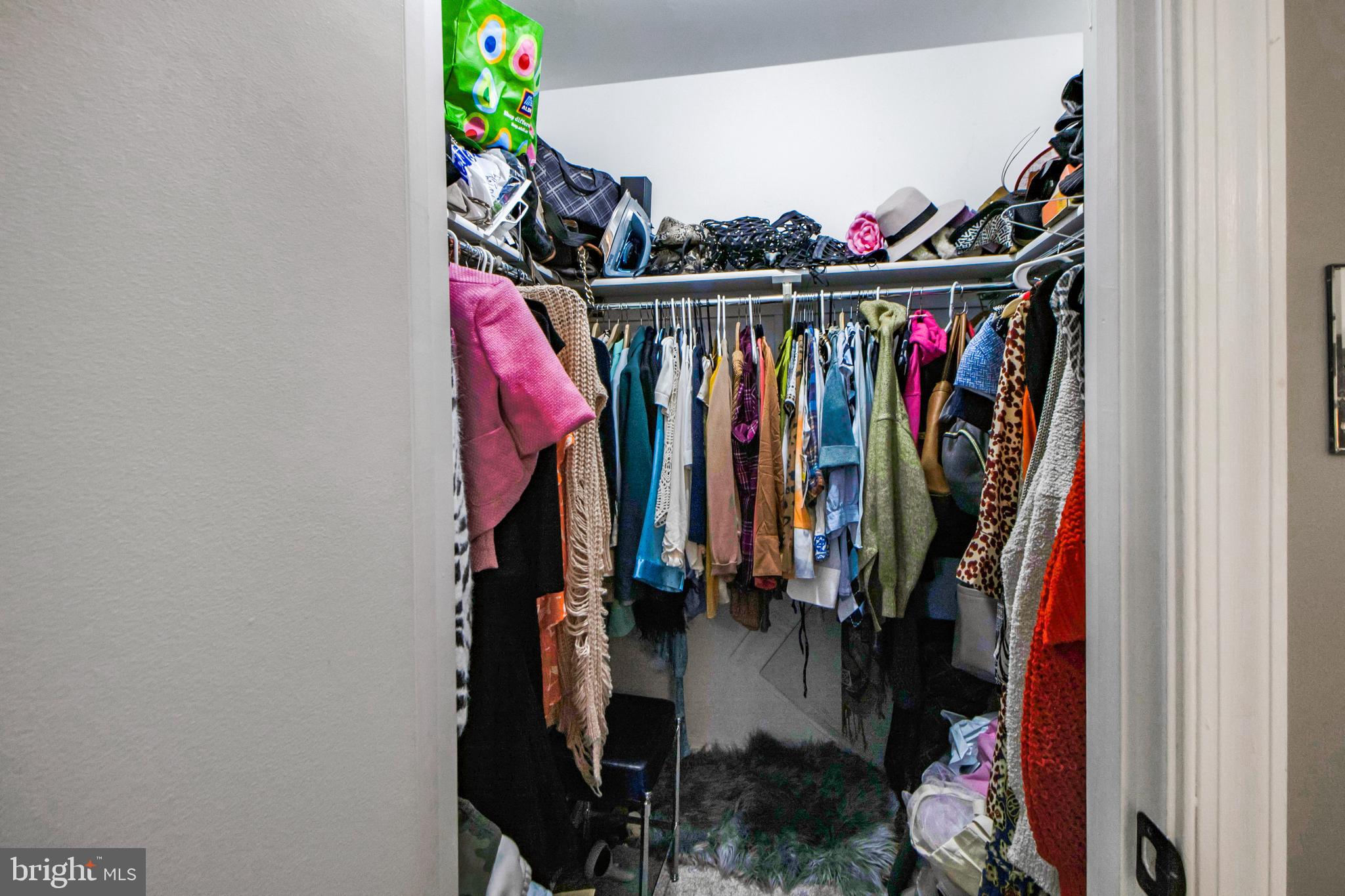 14432 Bakersfield Court Silver Spring, MD 20906 - Photo 35 of 60 a view of walk in closet with clothes