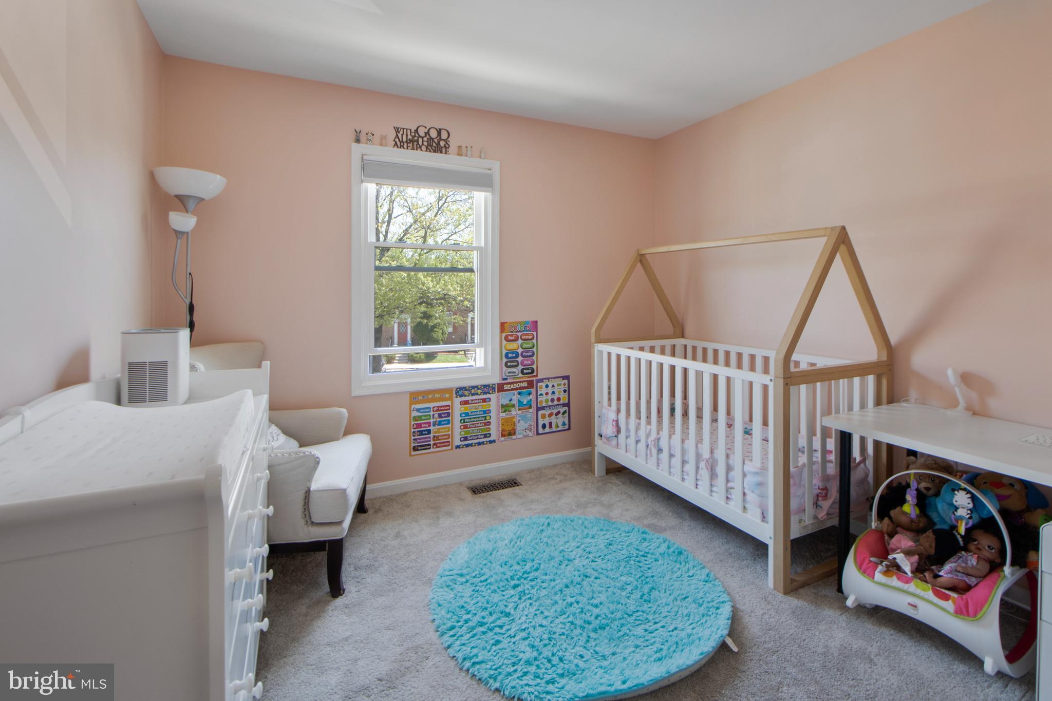 14432 Bakersfield Court Silver Spring, MD 20906 - Photo 44 of 60 a room with furniture a rug toys and a window