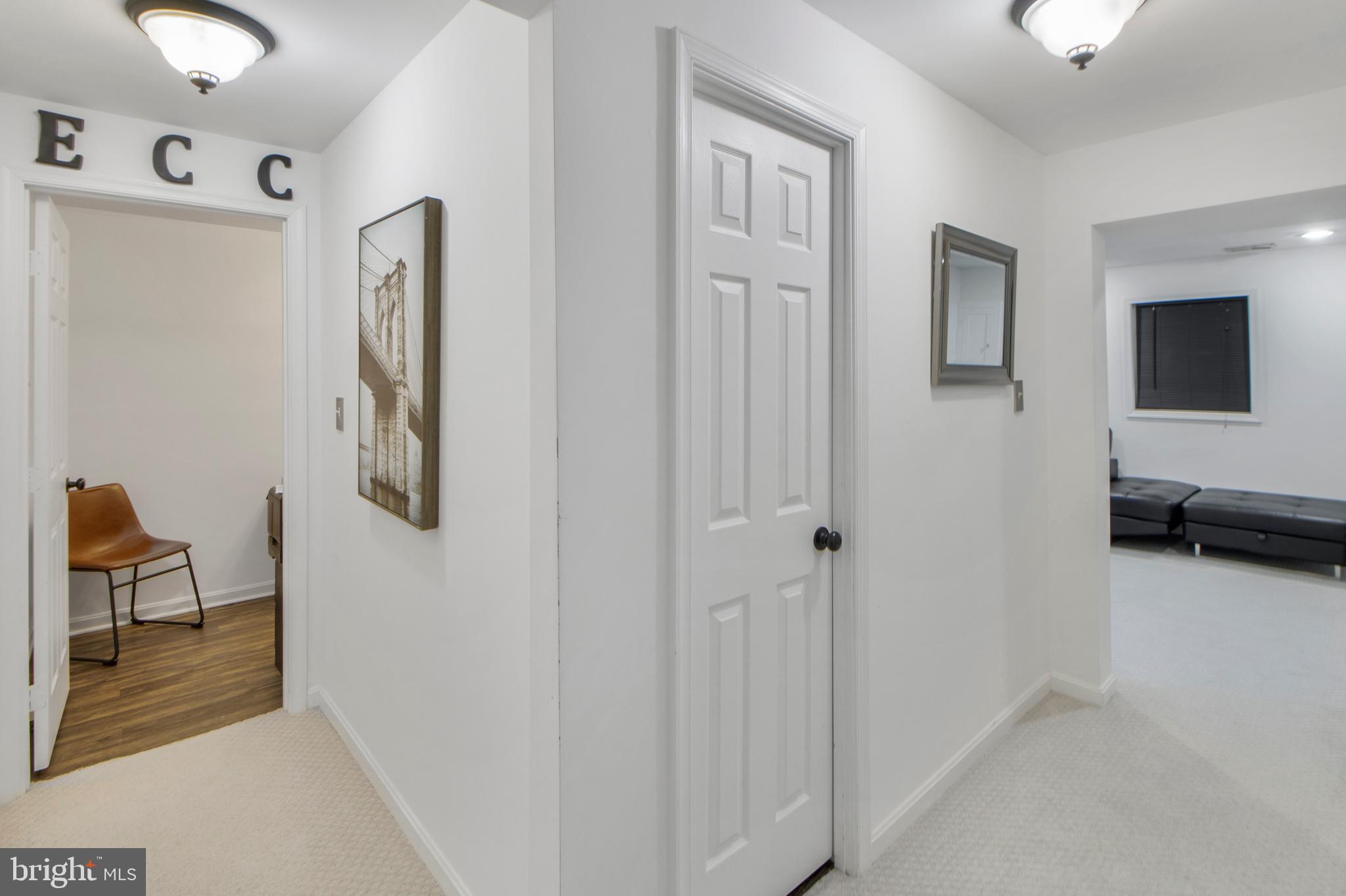 14432 Bakersfield Court Silver Spring, MD 20906 - Photo 47 of 60 a view of a livingroom with furniture and a flat screen tv