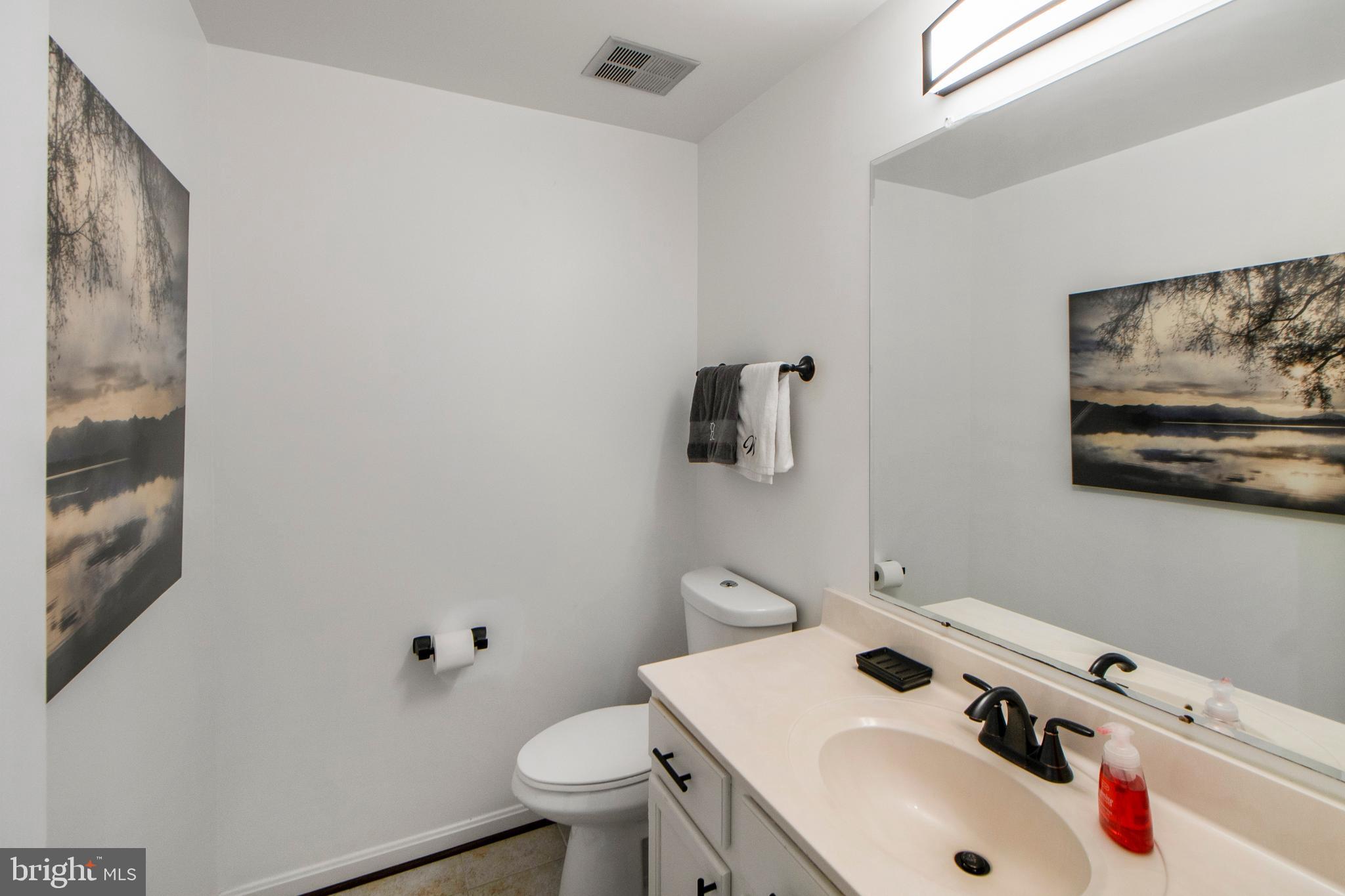 14432 Bakersfield Court Silver Spring, MD 20906 - Photo 48 of 60 a bathroom with a sink and a toilet