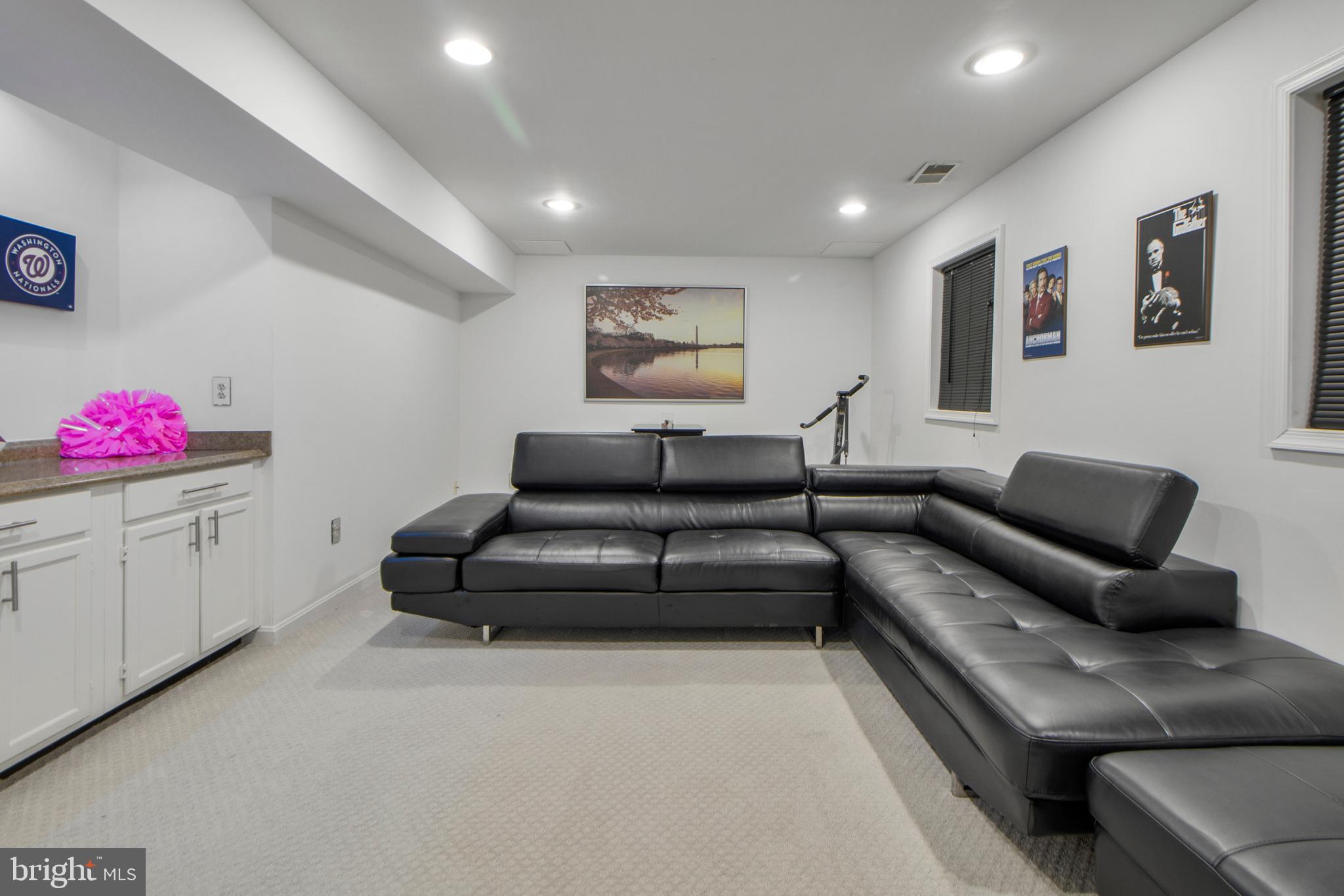 14432 Bakersfield Court Silver Spring, MD 20906 - Photo 49 of 60 a living room with furniture and a couch