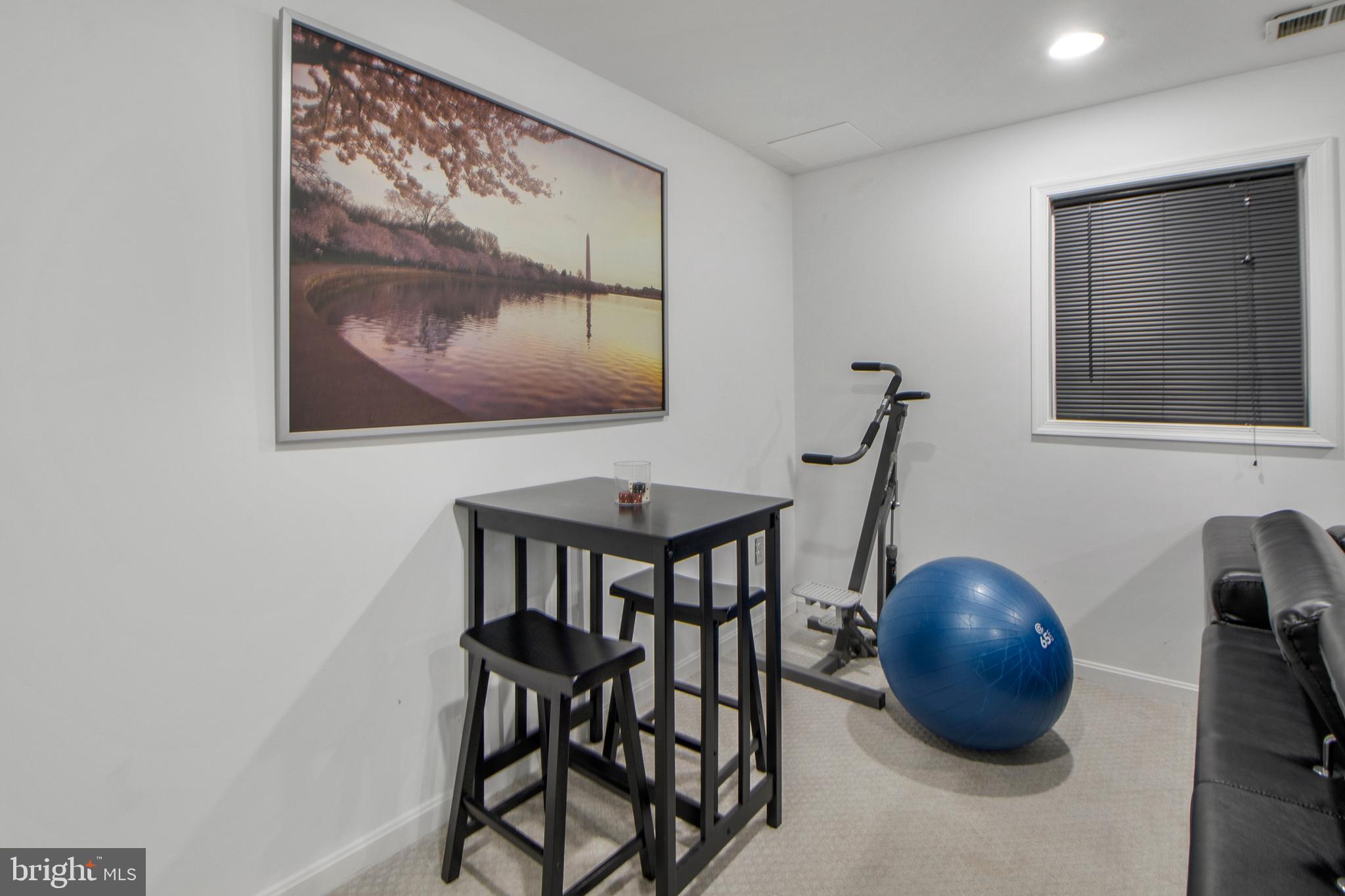 14432 Bakersfield Court Silver Spring, MD 20906 - Photo 52 of 60 a room with table and chairs