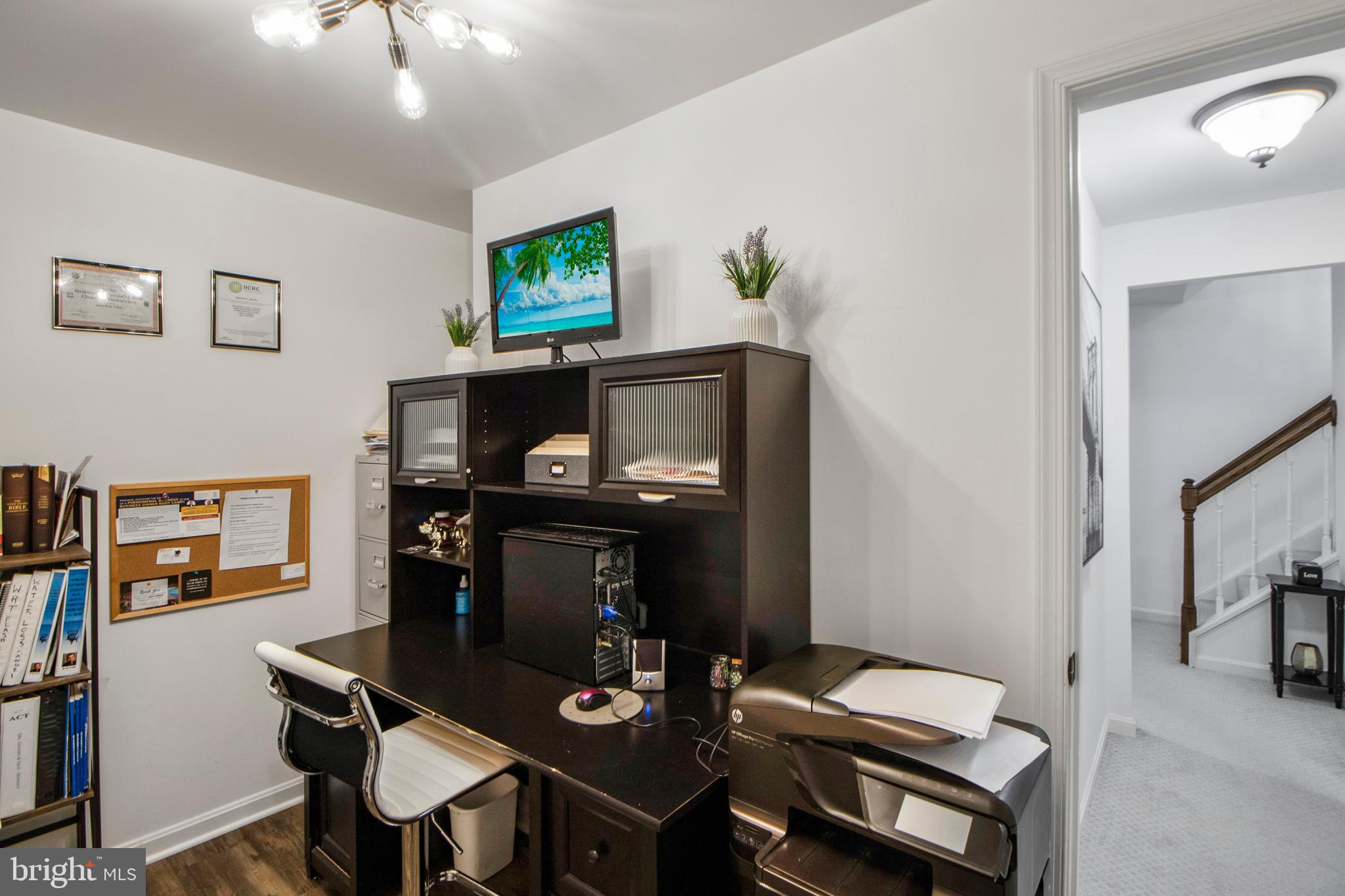 14432 Bakersfield Court Silver Spring, MD 20906 - Photo 54 of 60 a living room with furniture and a flat screen tv