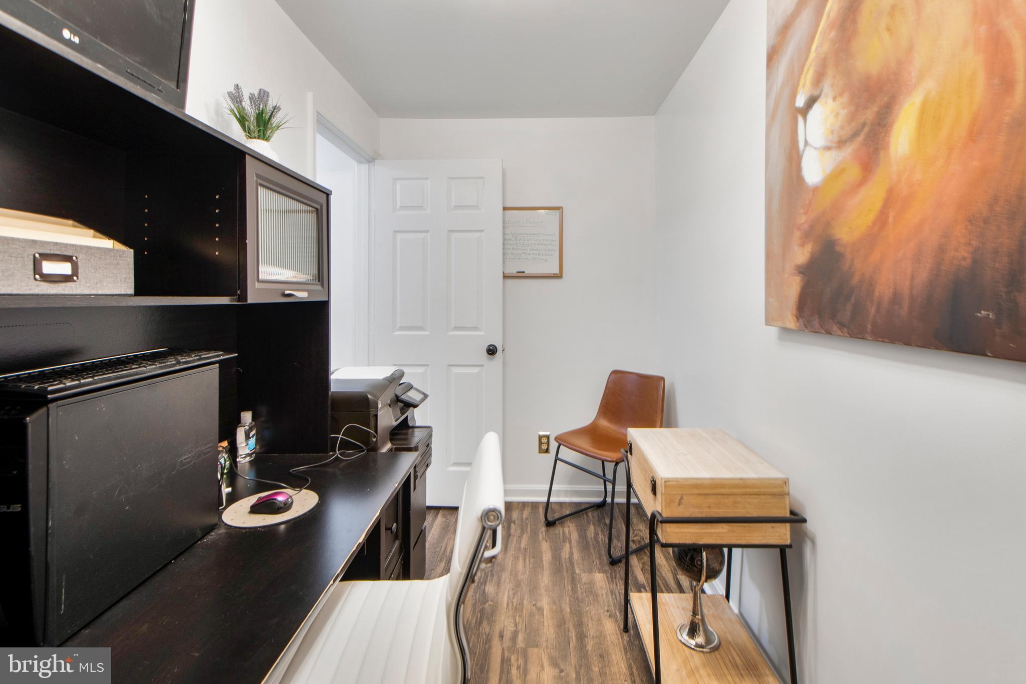 14432 Bakersfield Court Silver Spring, MD 20906 - Photo 55 of 60 a living room with furniture and a flat screen tv