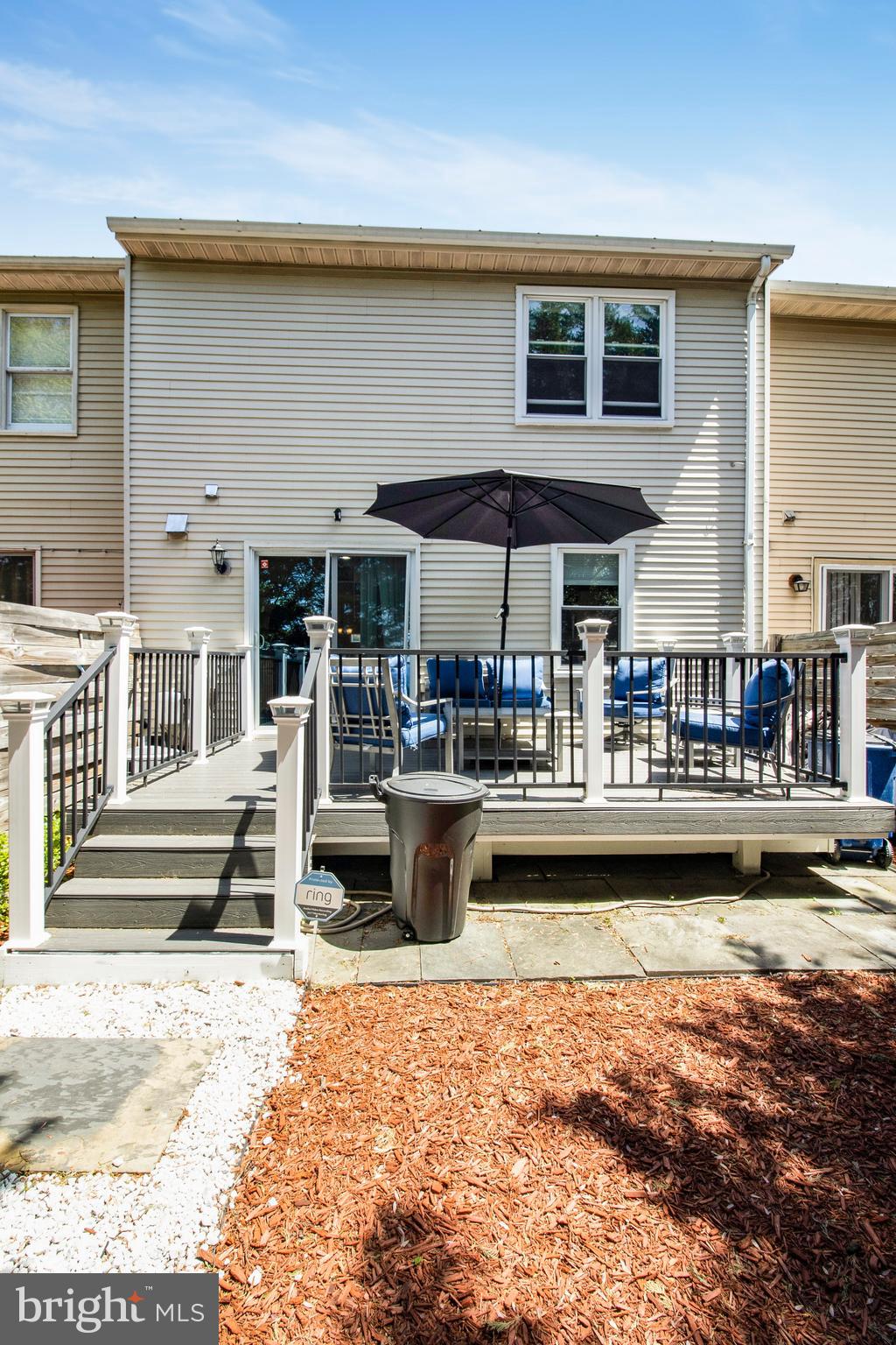 14432 Bakersfield Court Silver Spring, MD 20906 - Photo 56 of 60 a view of a swimming pool with outdoor seating