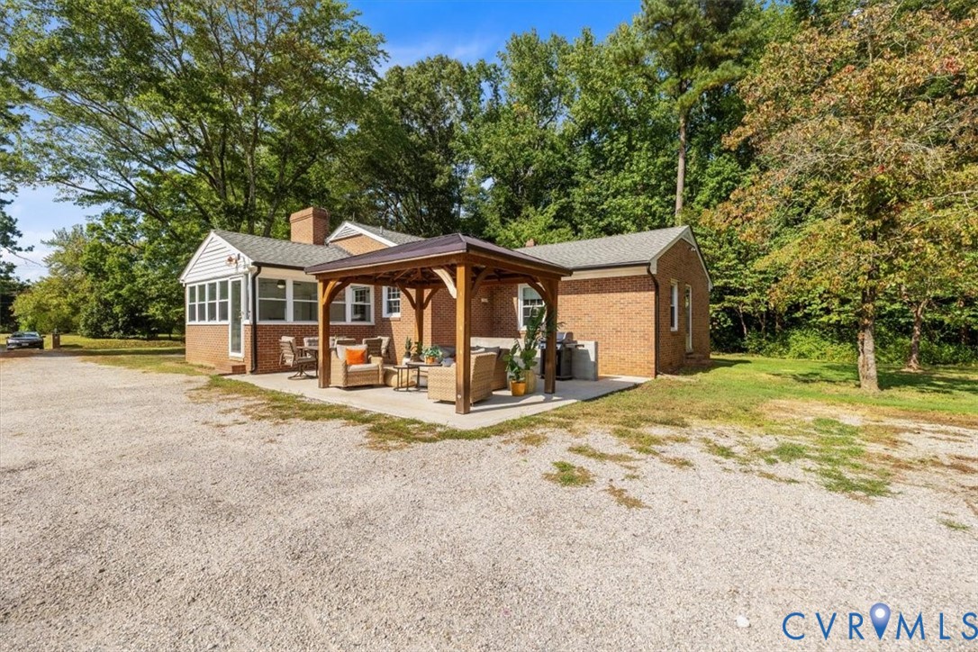2210 Cartersville Road Cartersville, VA 23027 - Photo 24 of 32 a view of a house with a yard and large tree