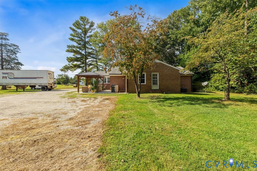 2210 Cartersville Road Cartersville, VA 23027 - Photo 27 of 32 a front view of a house with a garden