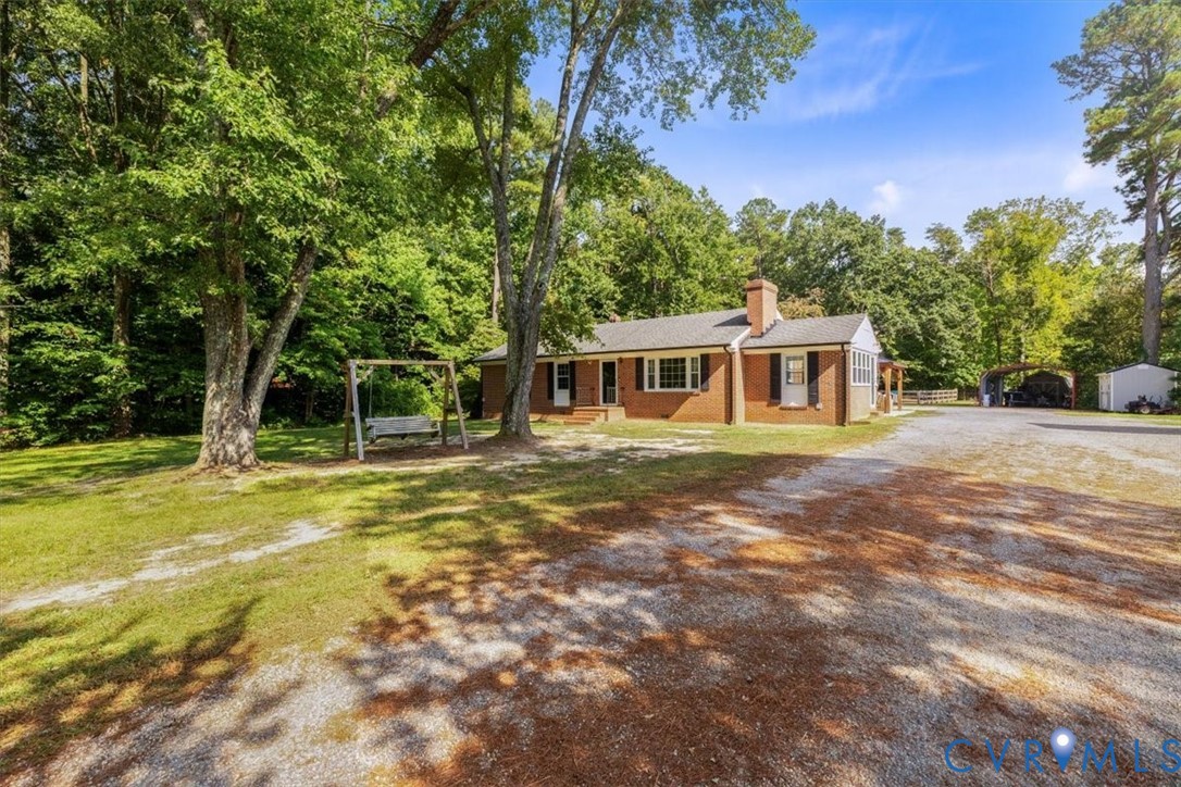 2210 Cartersville Road Cartersville, VA 23027 - Photo 30 of 32 a view of a house with a backyard