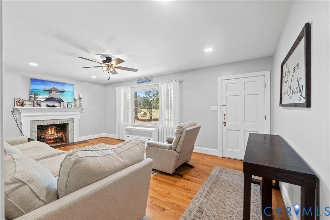 2210 Cartersville Road Cartersville, VA 23027 - Photo 4 of 32 a living room with furniture and a fireplace