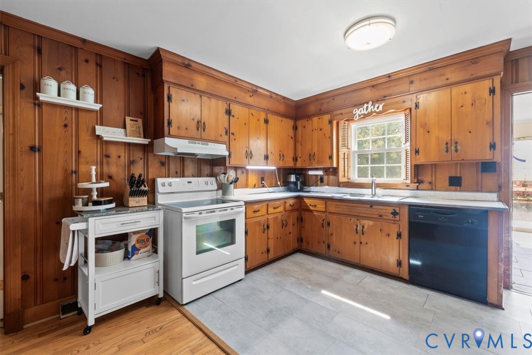 2210 Cartersville Road Cartersville, VA 23027 - Photo 7 of 32 a kitchen with stainless steel appliances granite countertop a stove a sink dishwasher and a refrigerator