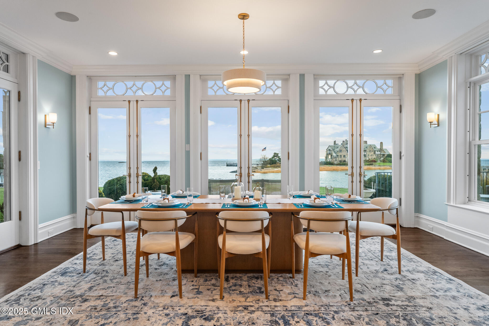 545 Indian Field Road Greenwich, CT 06830 - Photo 11 of 39 a dining room with furniture window and wooden floor
