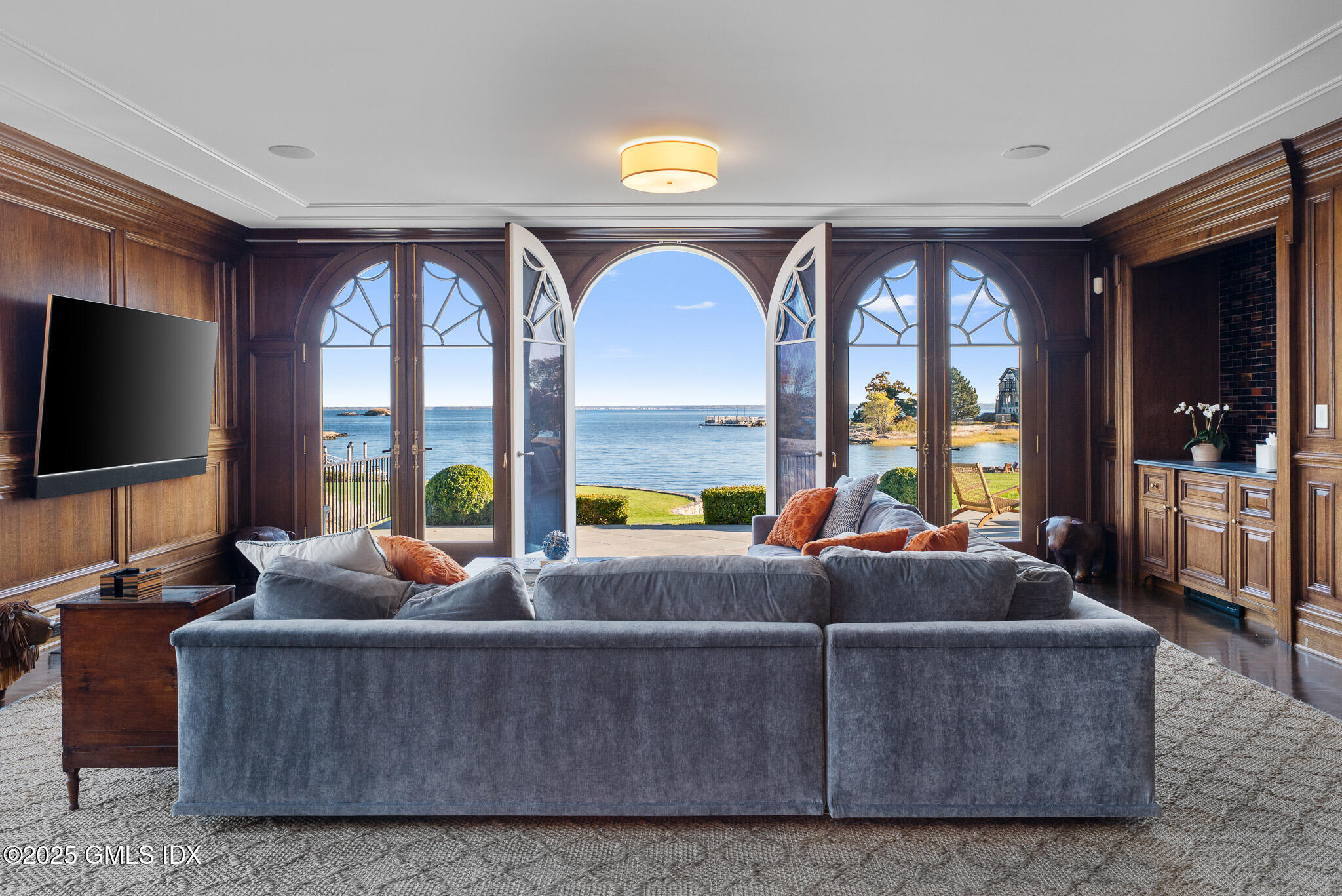 545 Indian Field Road Greenwich, CT 06830 - Photo 14 of 39 a living room with furniture and a flat screen tv