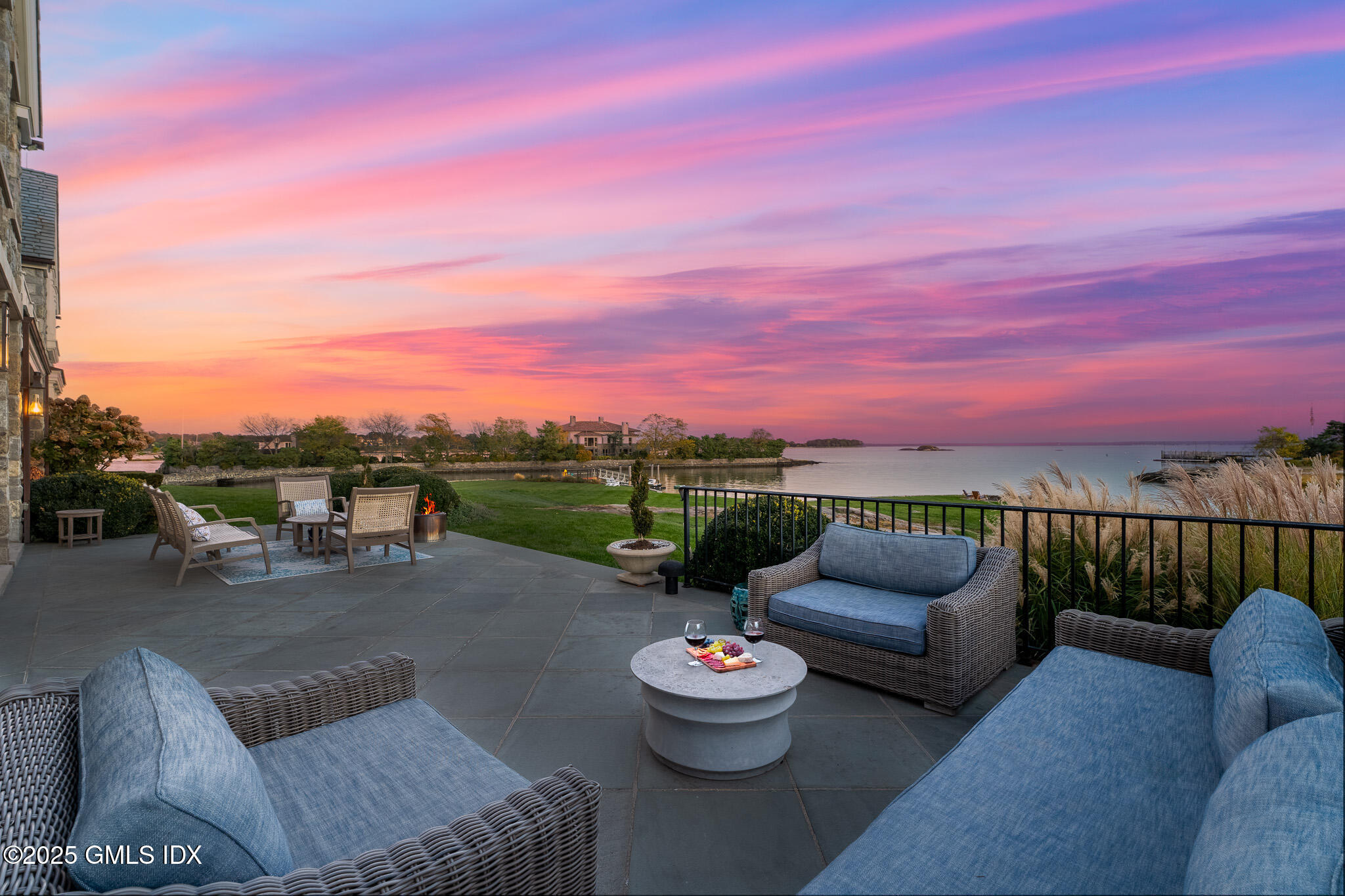 545 Indian Field Road Greenwich, CT 06830 - Photo 35 of 39 a view of a patio with couches and potted plants