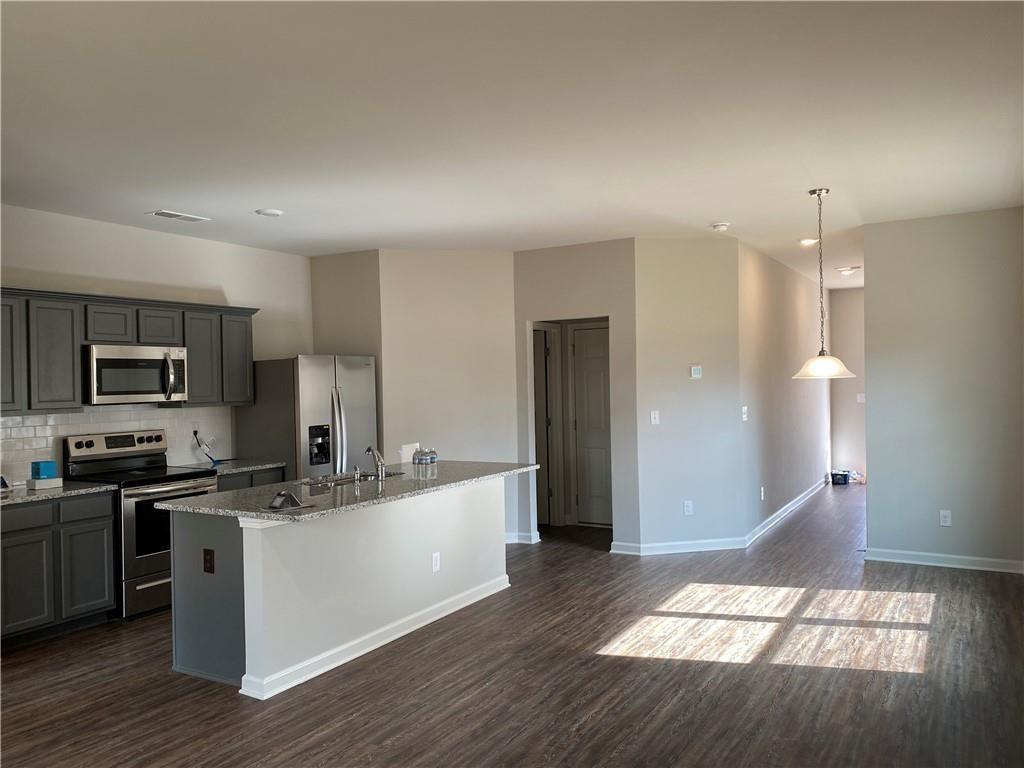 3577 Brycewood Drive Decatur, GA 30034 - Photo 4 of 13 a kitchen with stainless steel appliances granite countertop a sink stove and refrigerator