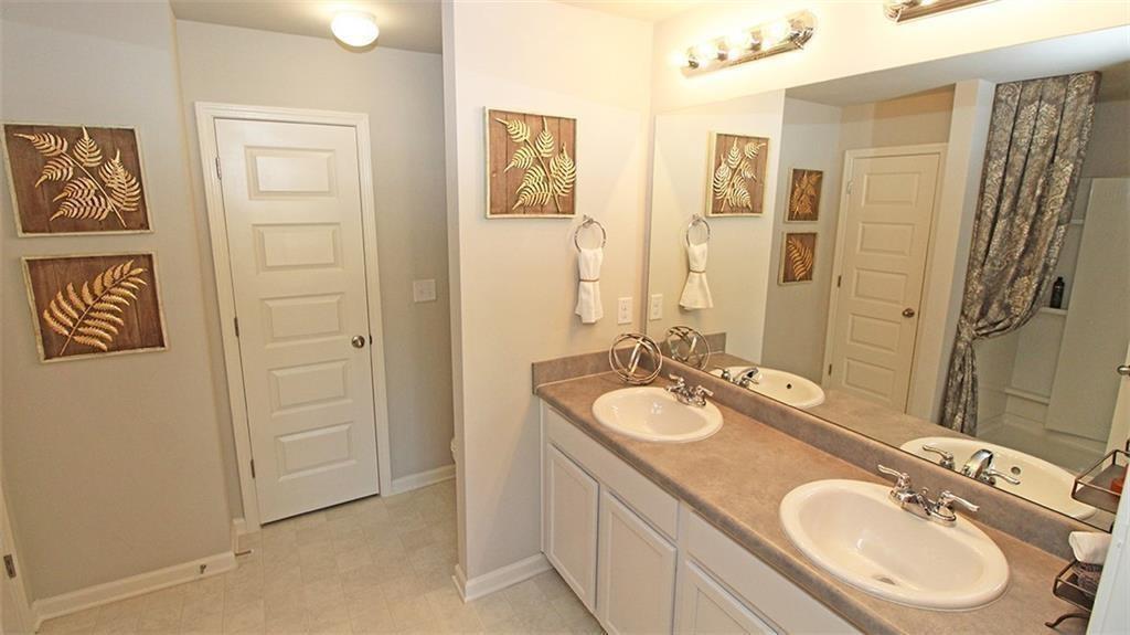 3577 Brycewood Drive Decatur, GA 30034 - Photo 10 of 13 a bathroom with a double vanity sink and a mirror