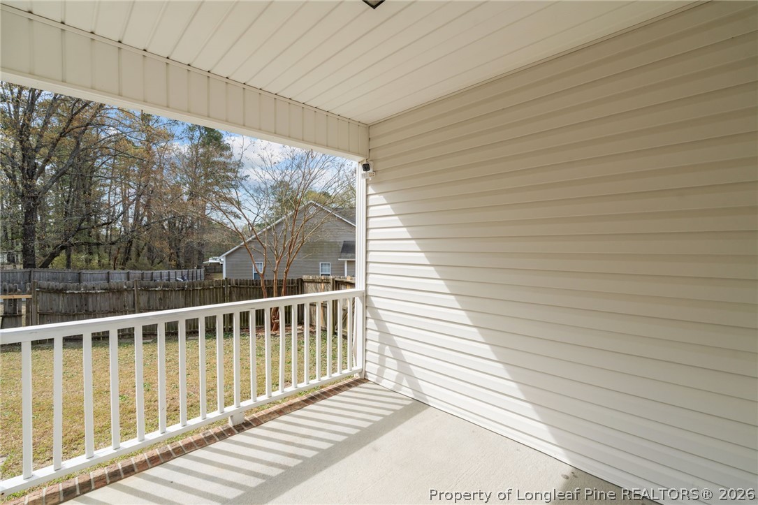 115 Shelby Street Spring Lake, NC 28390 - Photo 32 of 40 a view of a wooden balcony