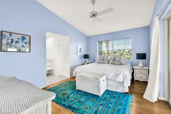 a en suite bedroom with a bed and a window