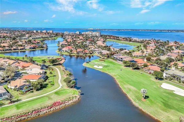 an aerial view of a house with a lake view