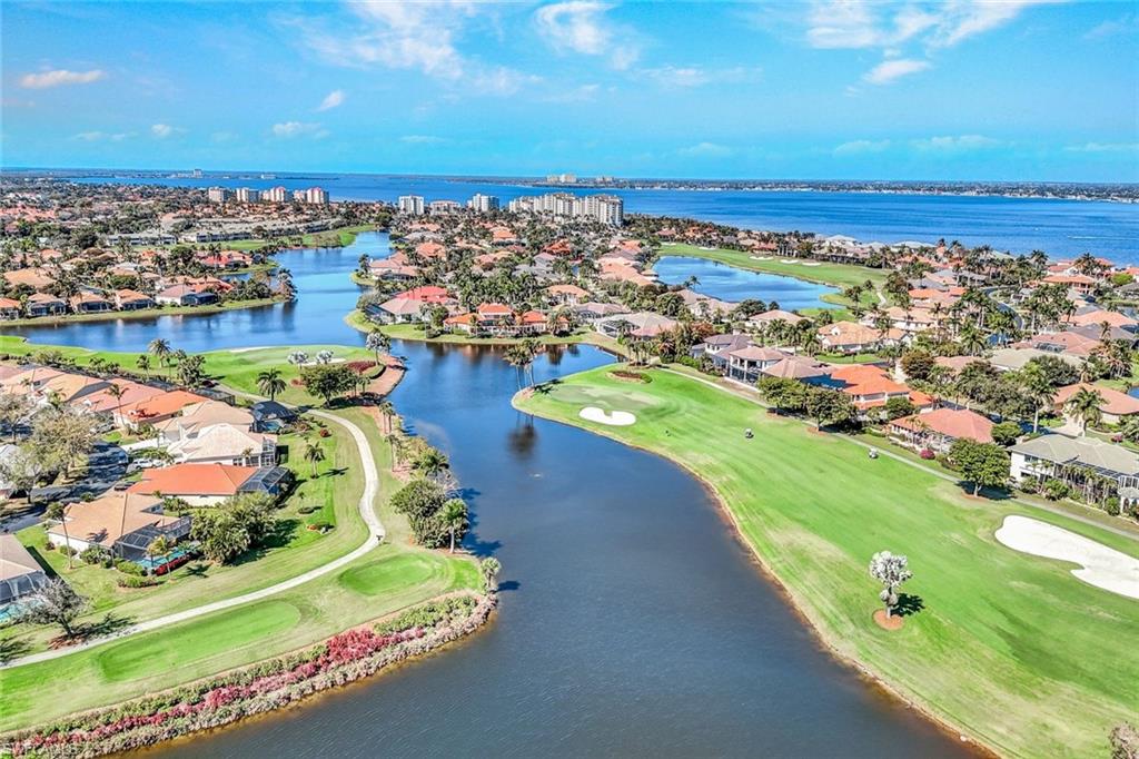 14985 Rivers Edge Court, Unit 236 Fort Myers, FL 33908 - Photo 26 of 33 an aerial view of ocean and residential houses with outdoor space