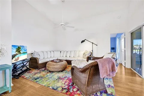 a view of a dining room with furniture wooden floor and a chandelier
