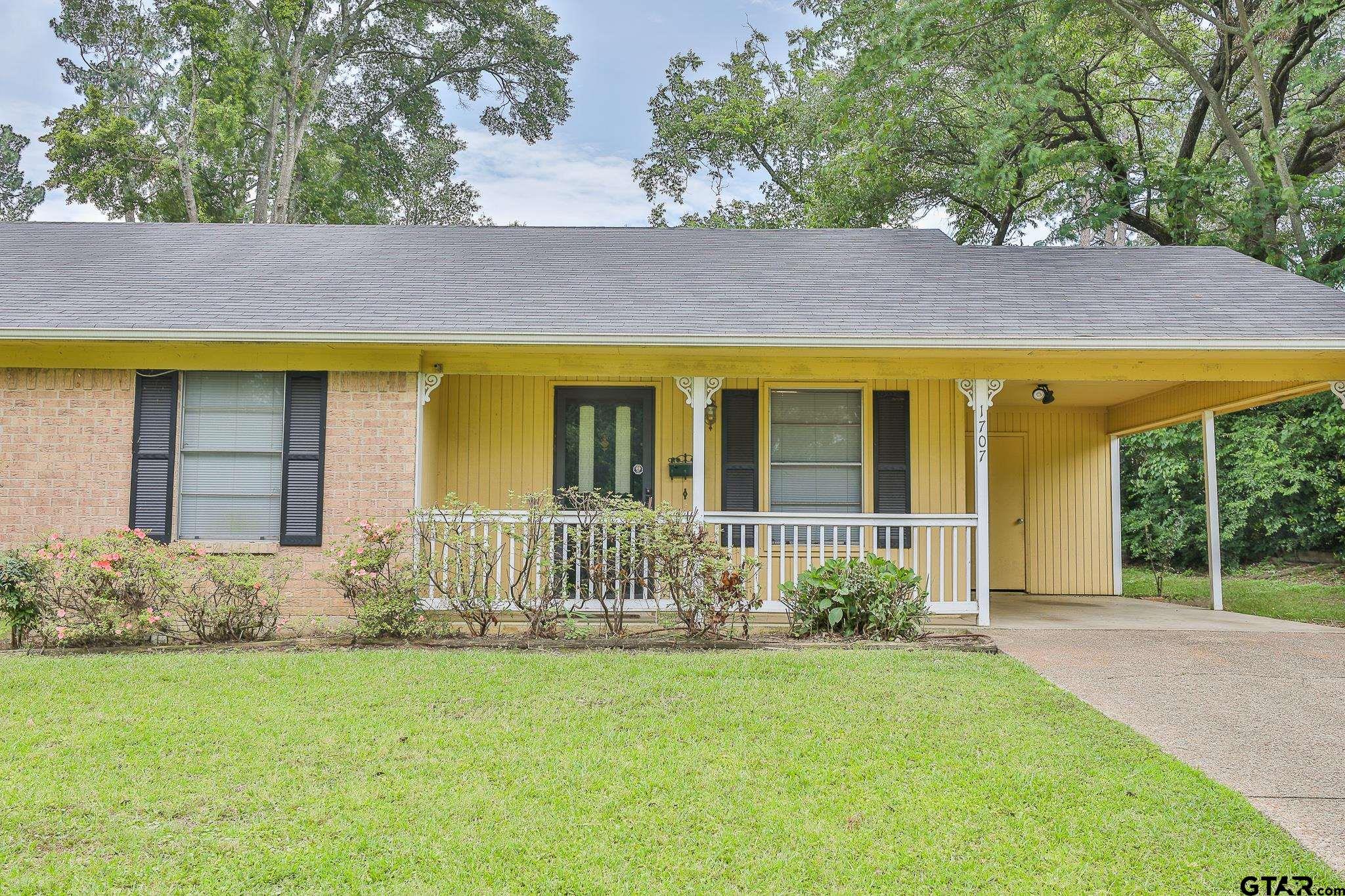1707 Sampson Drive Tyler, TX 75701 - Photo 2 of 24 a front view of a house with garden