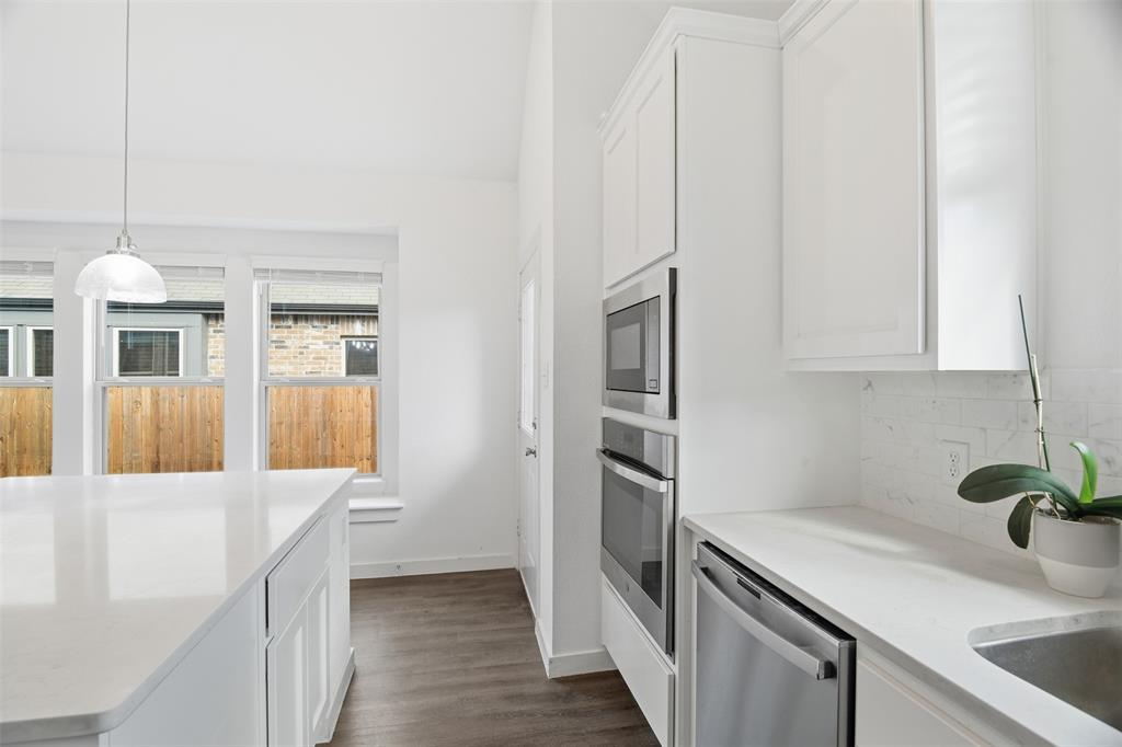 3910 Rochelle Lane Crandall, TX 75114 - Photo 16 of 32 a kitchen that has a lot of cabinets in it
