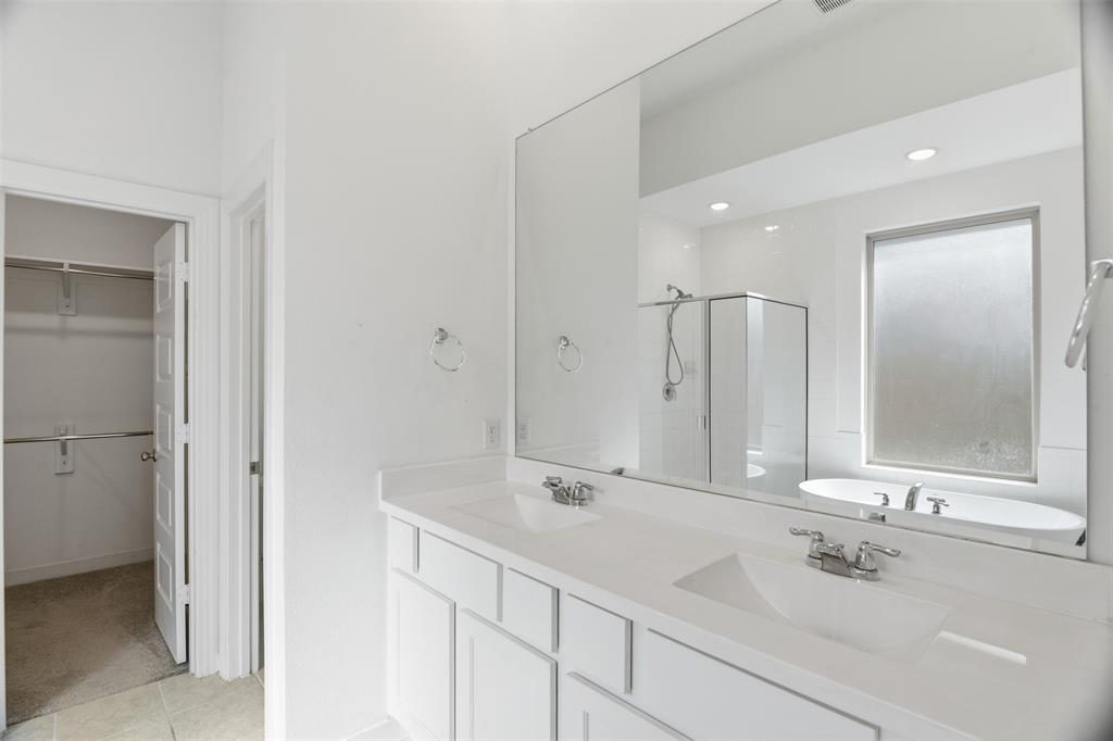 3910 Rochelle Lane Crandall, TX 75114 - Photo 23 of 32 a bathroom with a double vanity sink mirror and double
