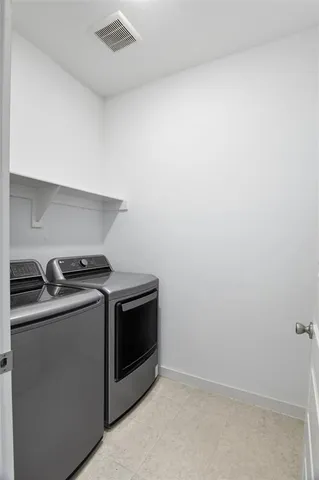 a bathroom with a bathtub and sink