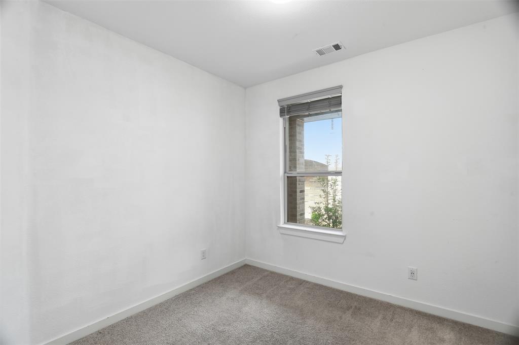 3910 Rochelle Lane Crandall, TX 75114 - Photo 29 of 32 an empty room with a window