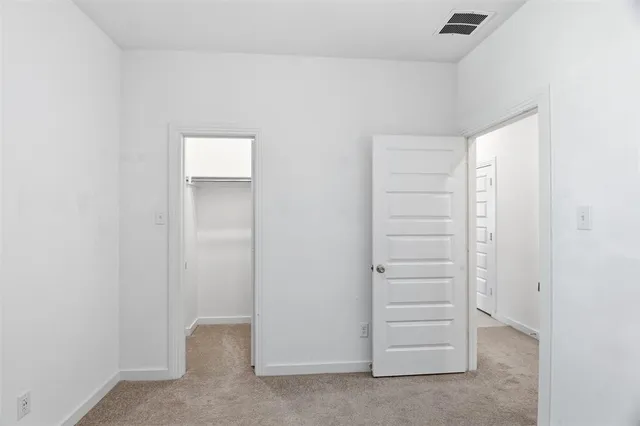 a view of walk in closet with cabinet