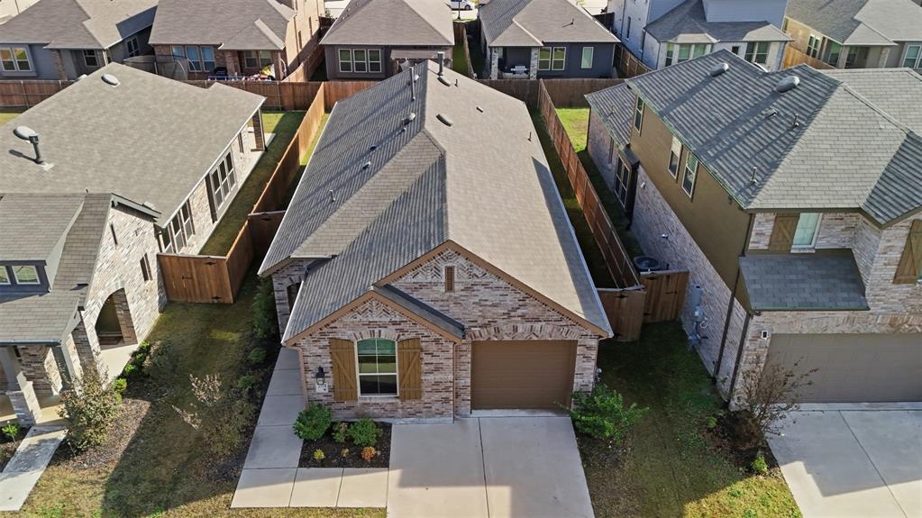 3910 Rochelle Lane Crandall, TX 75114 - Photo 4 of 32 an aerial view of residential houses with outdoor space