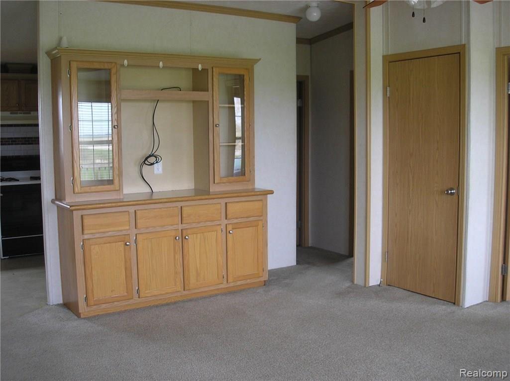 5938 North Hurds Corner Road Gagetown, MI 48735 - Photo 5 of 9 Another view of the living room with the entertainment center staying with the home.