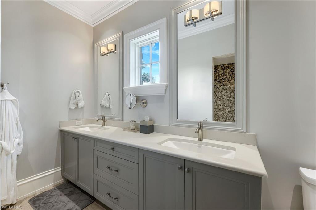 350 Springline Drive Naples, FL 34102 - Photo 19 of 33 Full bathroom with ornamental molding and double vanity