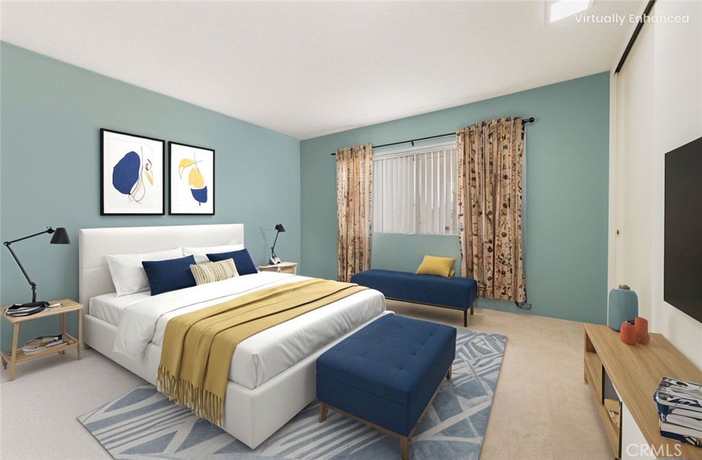 191 Kennebec Avenue, Unit 301 Long Beach, CA 90803 - Photo 9 of 14 a bedroom with a bed and a chandelier