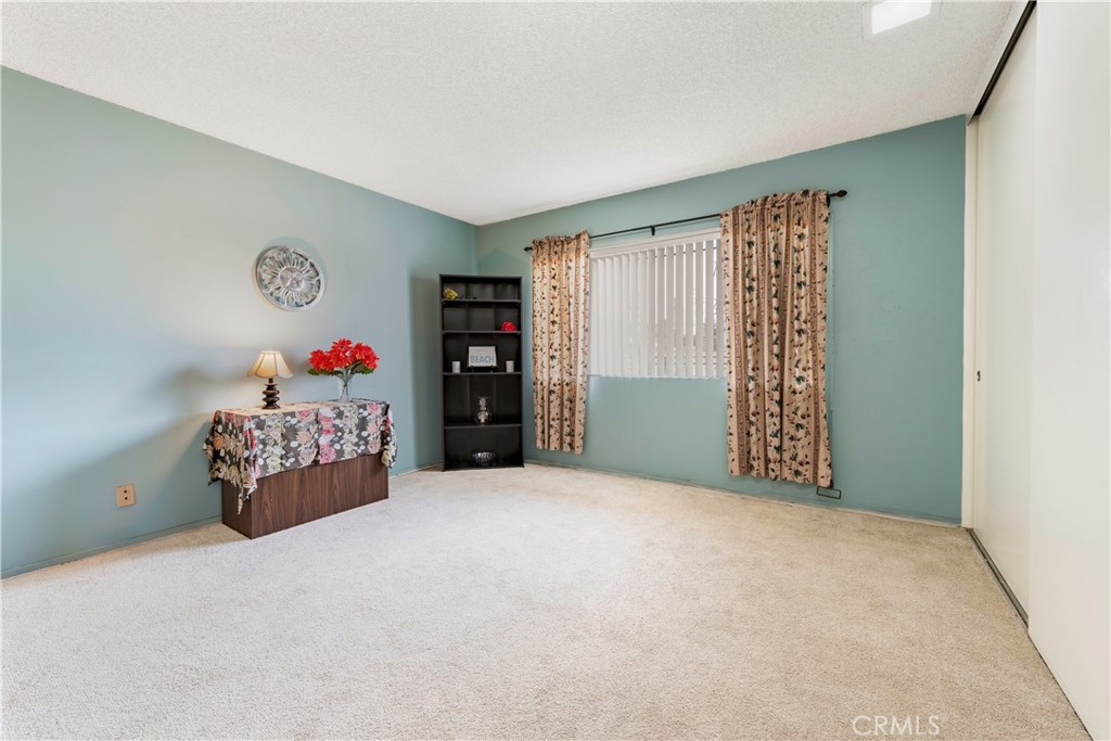 191 Kennebec Avenue, Unit 301 Long Beach, CA 90803 - Photo 10 of 14 a view of an empty room with closet and workspace