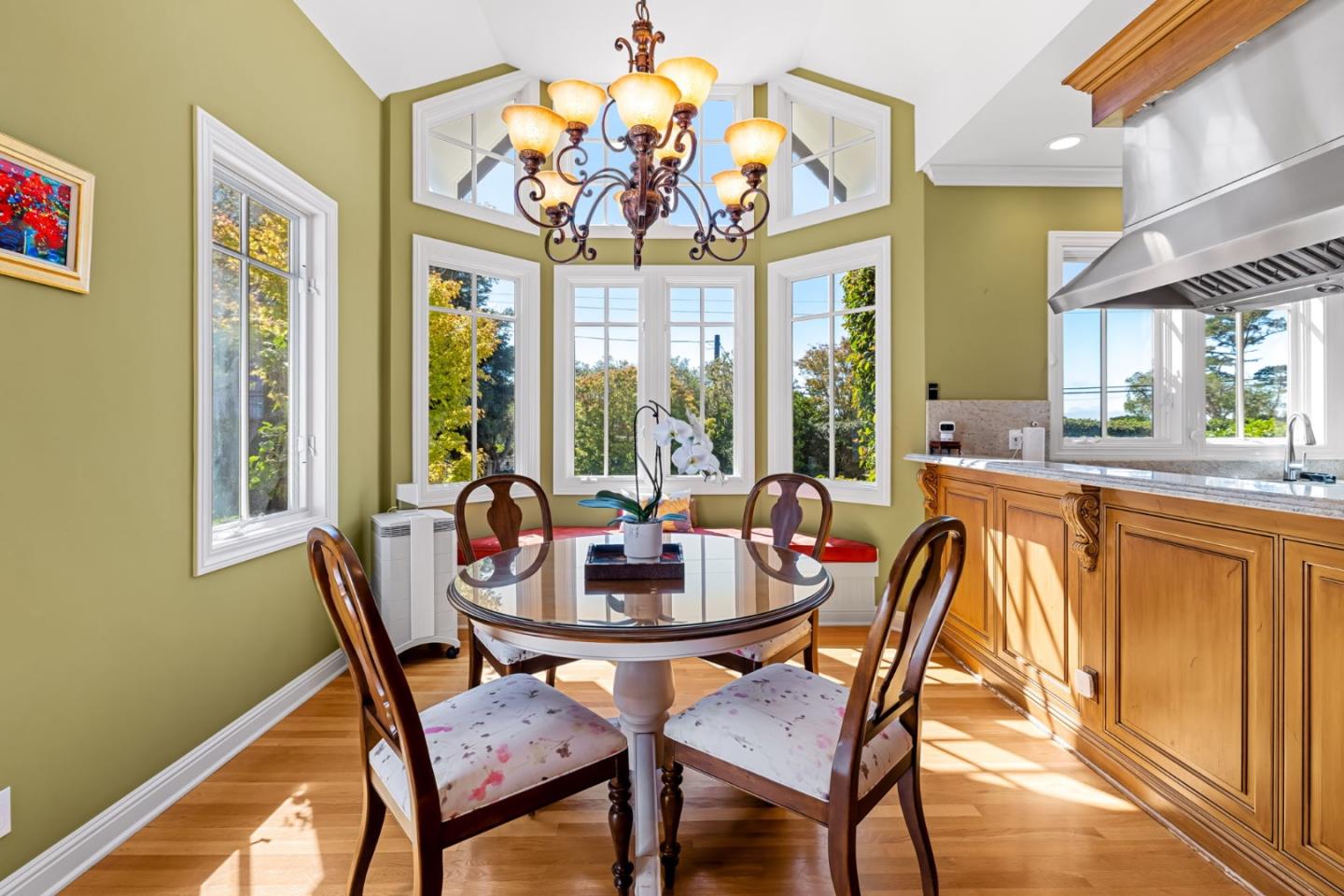 3937 Ronda Road Pebble Beach, CA 93953 - Photo 13 of 25 a dining room with furniture a large window and a chandelier