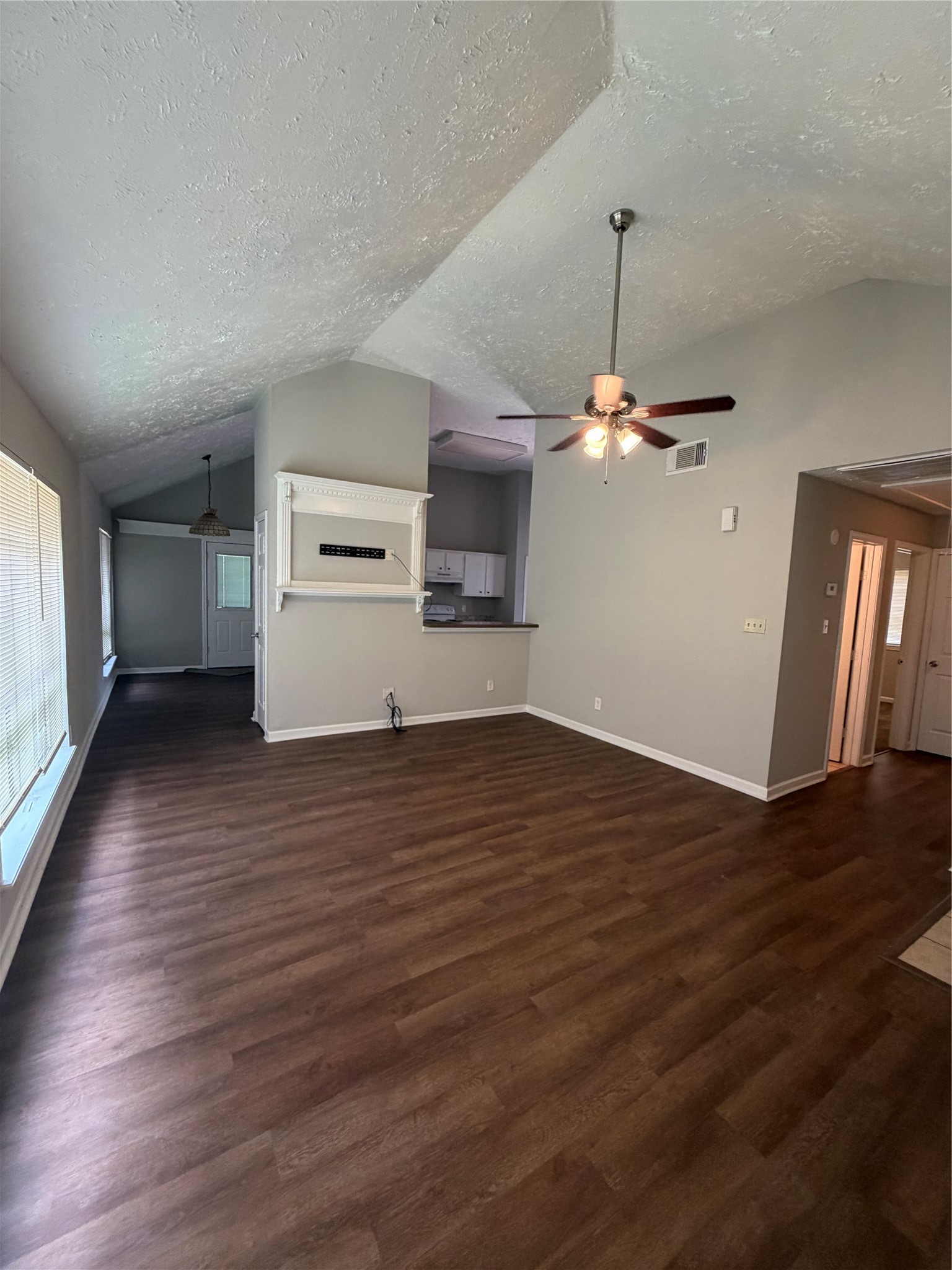 8662 Pearl Point Street Houston, TX 77044 - Photo 3 of 28 a view of a room with wooden floor fireplace and window