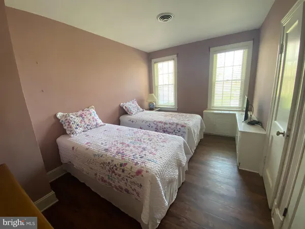 a bedroom with bed and window