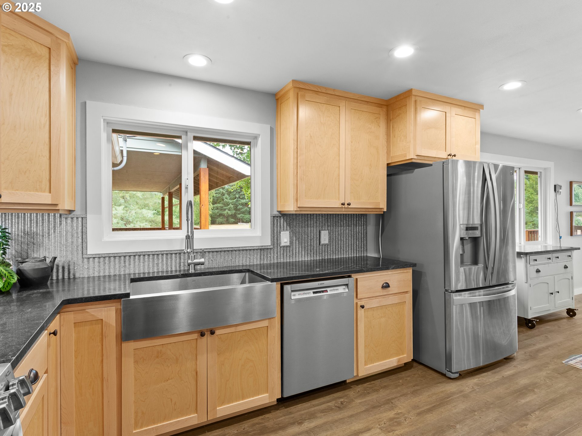 34603 Southeast Jarl Road Boring, OR 97009 - Photo 12 of 48 a kitchen with a sink a refrigerator a window and cabinets