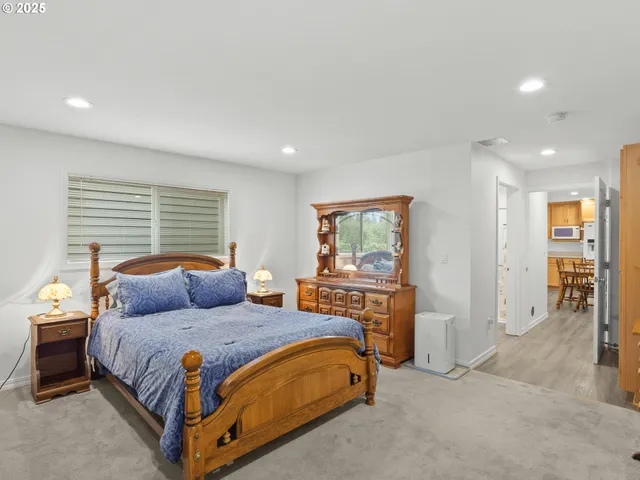 a bedroom with a bed and a couch